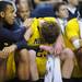 Michigan sophomore Jon Horford consoles his teammate sophomore Evan Smotrycz in the last few seconds of their 65-60 loss to Ohio University in the second round of the NCAA tournament at Bridgestone Arena in Nashville, Tenn.  Melanie Maxwell I AnnArbor.com